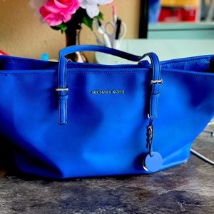 Used micheal Khors tote with dust bag